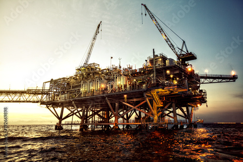 oil rig at sunset with beautiful lights