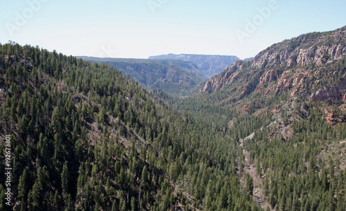A ravine is generally a fluvial slope landform of relatively steep sides.