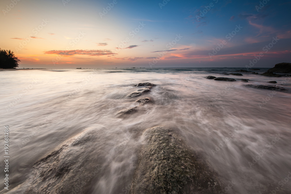 waves trails and beautiful sunset sky. soft focus due to slow shutter and water movement. waves trails and beautiful sunset sky. soft focus due to slow shutter and water movement.
