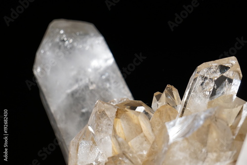 Close-Up of Rough Clear Crystal Spikes Against A Black Background