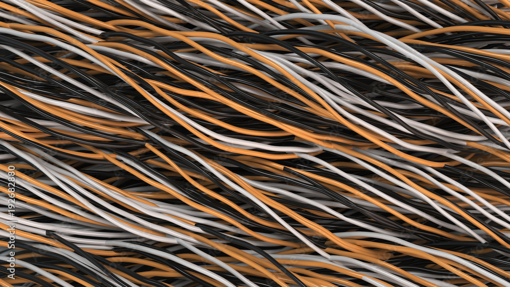 Twisted black, white and orange cables and wires on black surface Twisted black, white and orange cables and wires on black surface