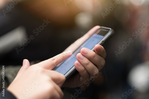 Close up of Woman holding smartphone mobile  taping in cell phone