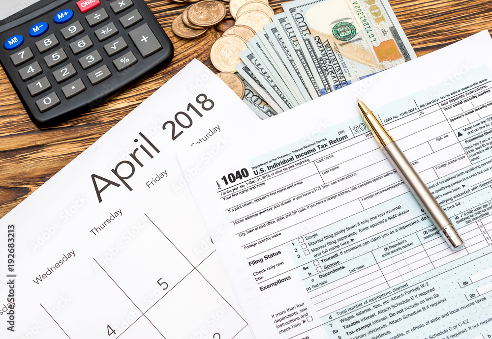 Tax forms with money, calculator and calendar on the table. Business concept. Tax forms with money, calculator and calendar on the table. Business concept.