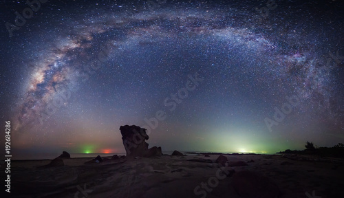 Stitched Panorama Starry night sky with milkyway galaxy. Image contain soft focus, blur and noise due to long expose and high iso. photo