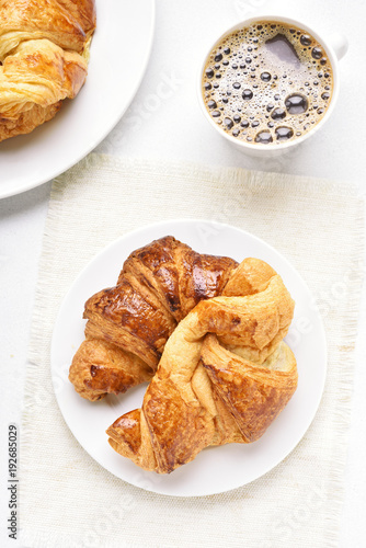 Croissants and cup of coffee, top view