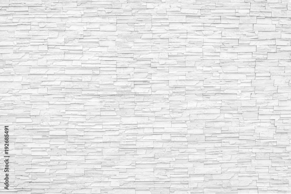 Naklejka premium Rock stone brick tile wall aged texture detailed pattern background in cream beige brown color