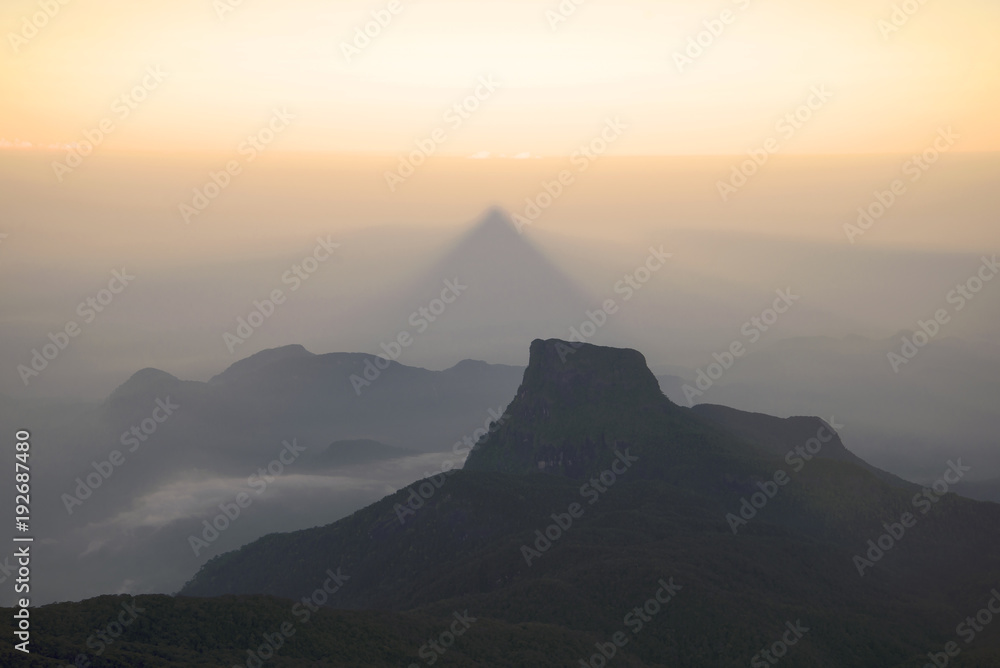 Triangular shadow from the mountain Adam's Peak on the sunrise. Sri Lanka