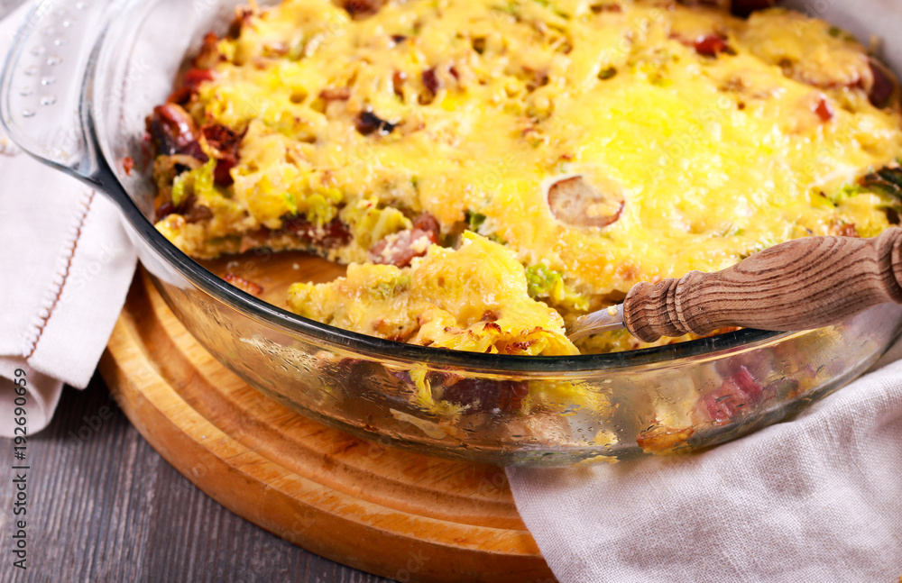 Savoy cabbage, sausage and cheese gratin