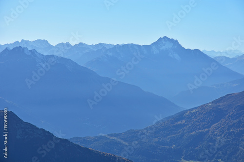 Silhouette of mountains in the European Alps in cold blue light. Hoher Riffler, Austria.