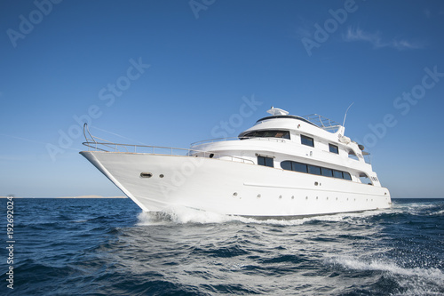 Luxury private motor yacht sailing at sea