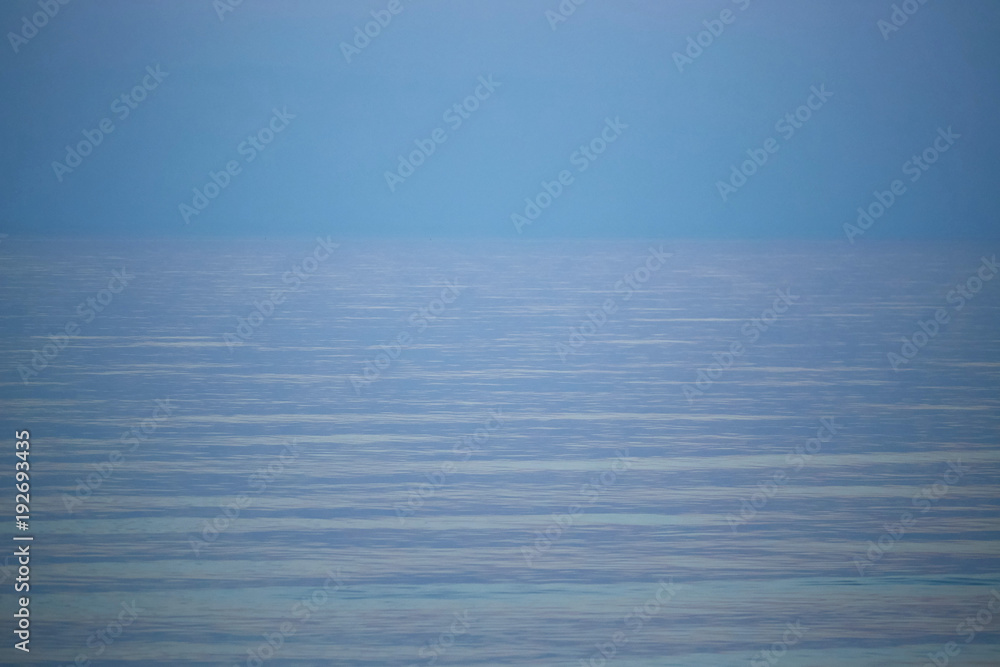 Fototapeta premium colorful sunset on a calm sea horizon