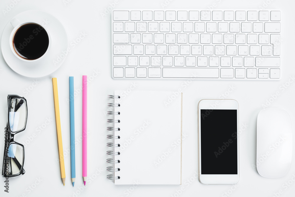 Creative desk with blank smartphone Creative desk with blank smartphone