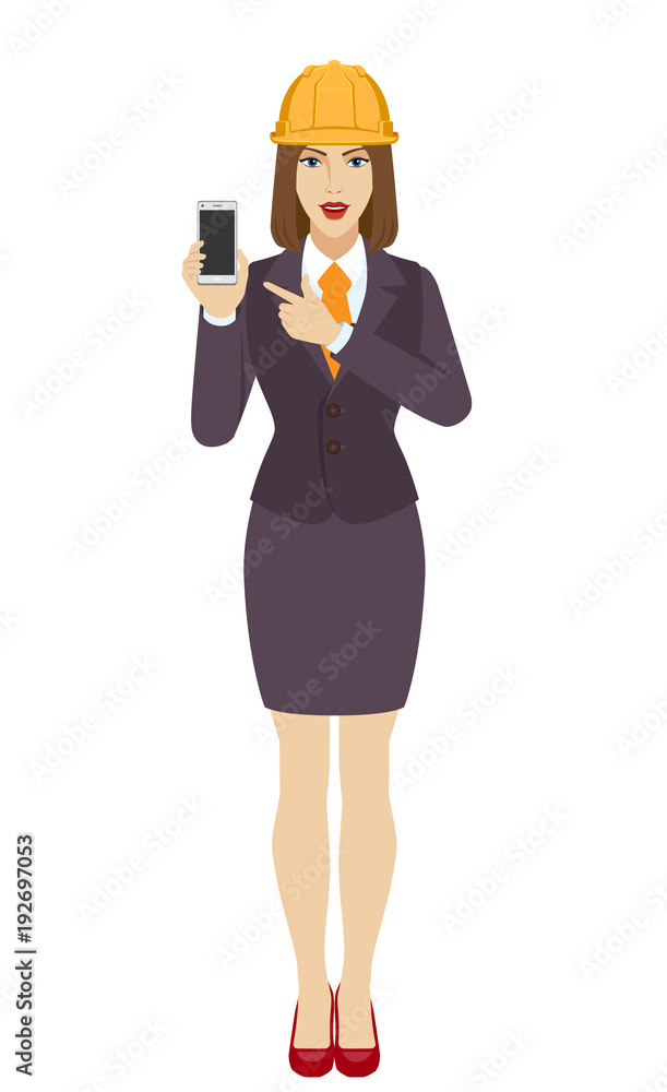 Businesswoman in construction helmet pointing at a mobile phone.