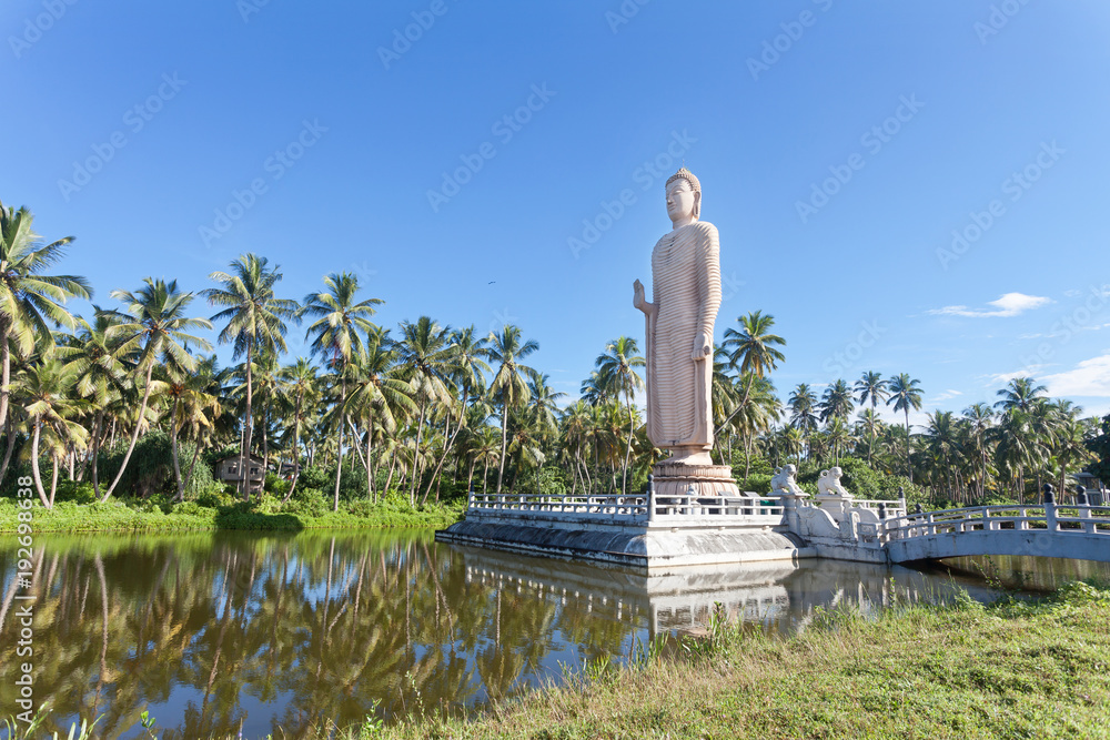 Sri Lanka, Hikkaduwa - A huge Buddha statue in the middle of a lake