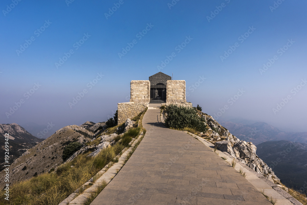 Fototapeta premium Sunrise at Njegusi mausoleum in the mountains of Lovcen National park, close-up, Montenegro, Europe
