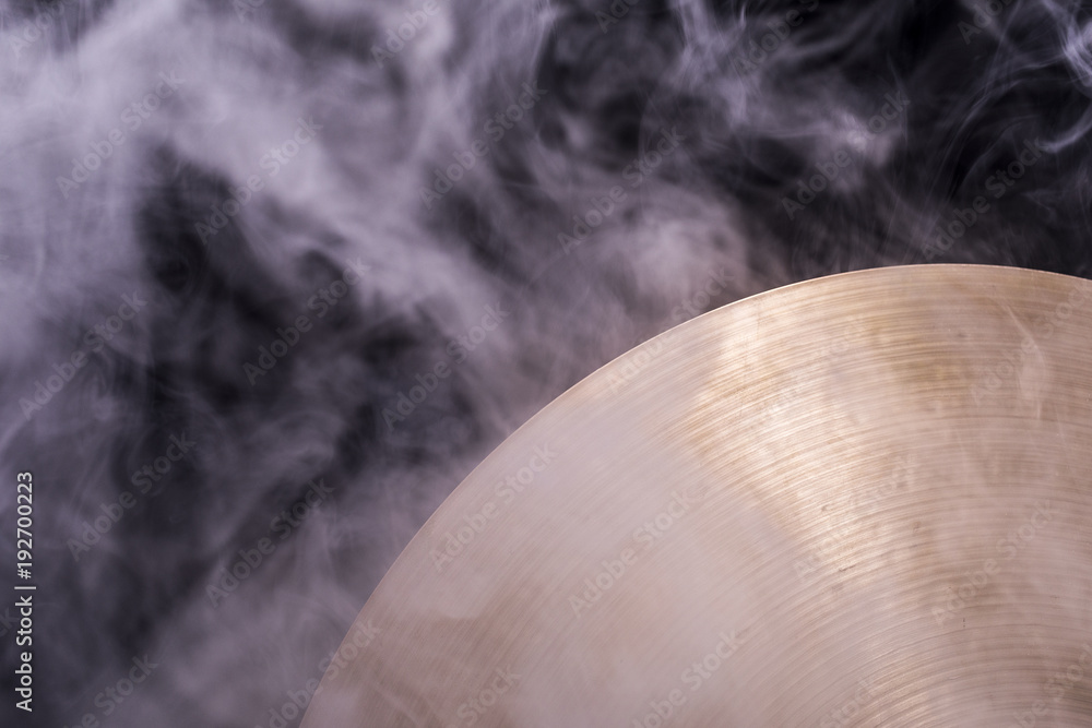 A cymbal with smoke