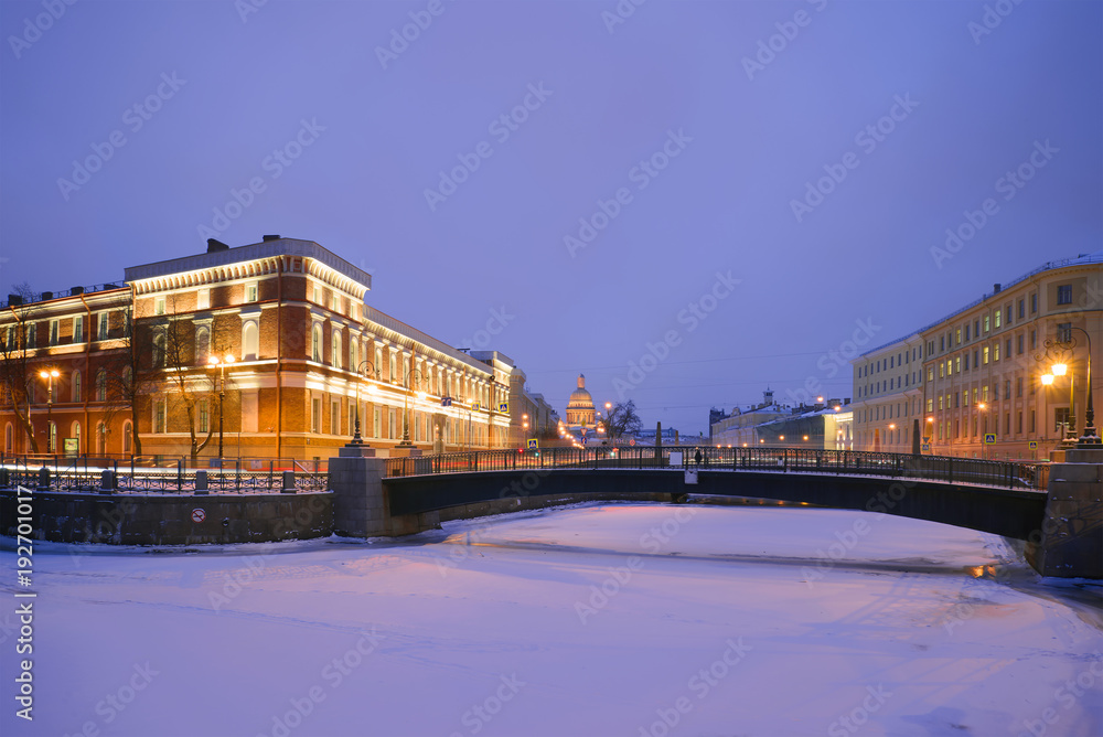 View of the Potseluev Bridge in January twilight. Saint Petersburg, Russia