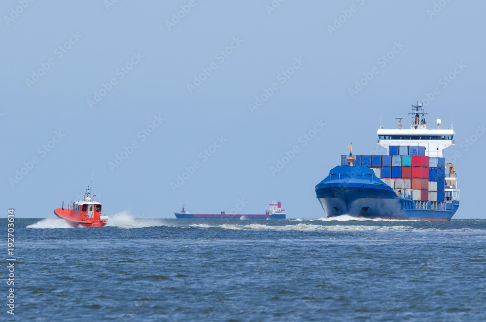 Fototapeta premium CONTAINER SHIP AND PILOT VESSEL - Shiping traffic near the port
