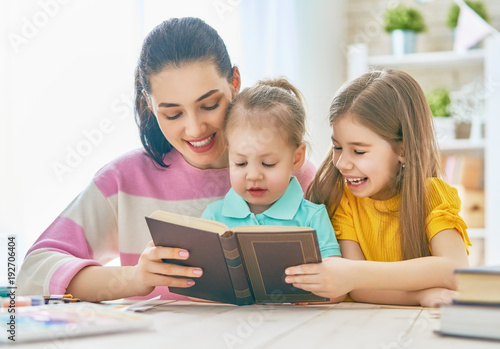 Mom and children reading a book