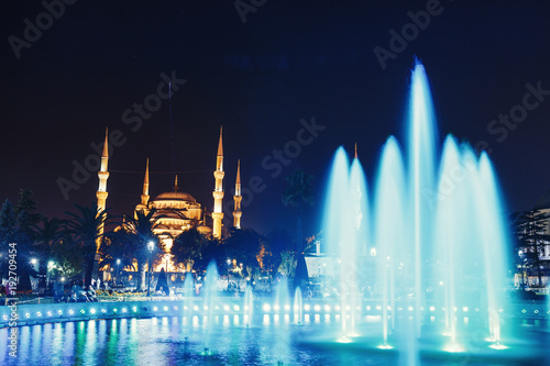 Night view at illuminated fountain and blue mosque in Istanbul