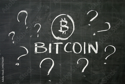 What is bitcoin? Written on the blackboard with white chalk photo