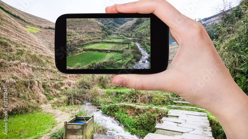 tourist photographs terraced fields in Dazhai photo