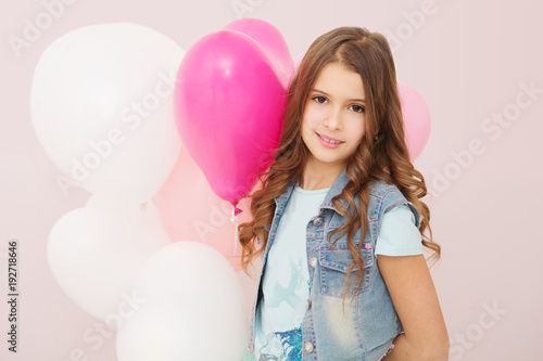 Happy cute girl with balloons. mother's day, birthday