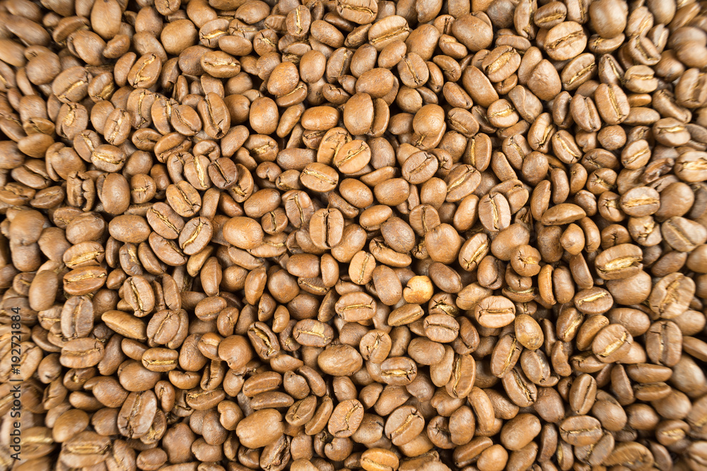 Light roast brown coffee beans. Potential use as a background Light roast brown coffee beans. Potential use as a background