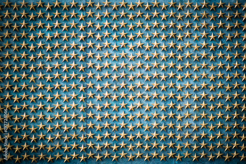 Golden stars on the blue background, symbol of American freedom photo