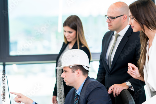 Group Of Architects Having Meeting. Solving problems and making strategy on computer. © Senad