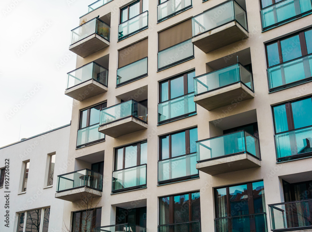 typical modern apartment house with much glass in vintage colors typical modern apartment house with much glass in vintage colors