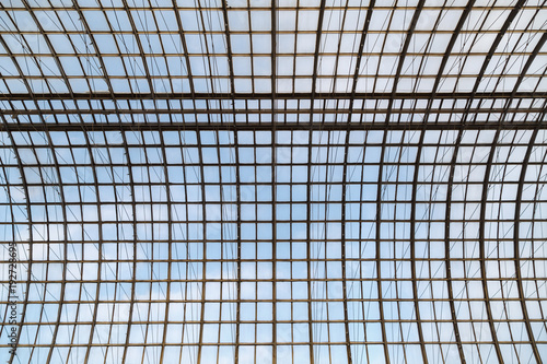 Semicircular glass transparent roof on a metal frame as a background or a backdrop