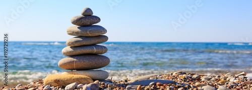 Spa stones balance on beach.