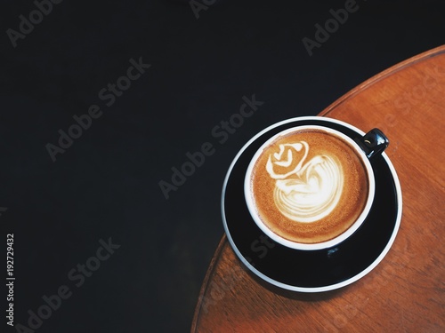  Hot Coffee latte art on wooden table in coffee shop,coffee time or coffee break. photo