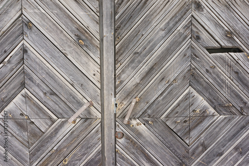 Vintage wooden fence with traces of old paint, scuffs and scratches. Photo close-up 