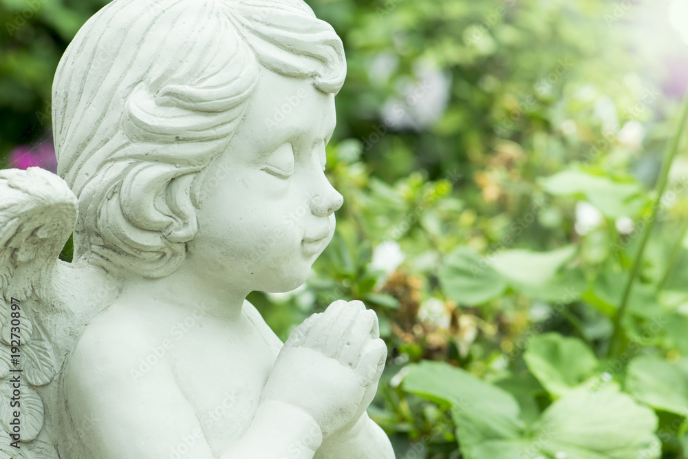 Young Angel Sculpture in garden