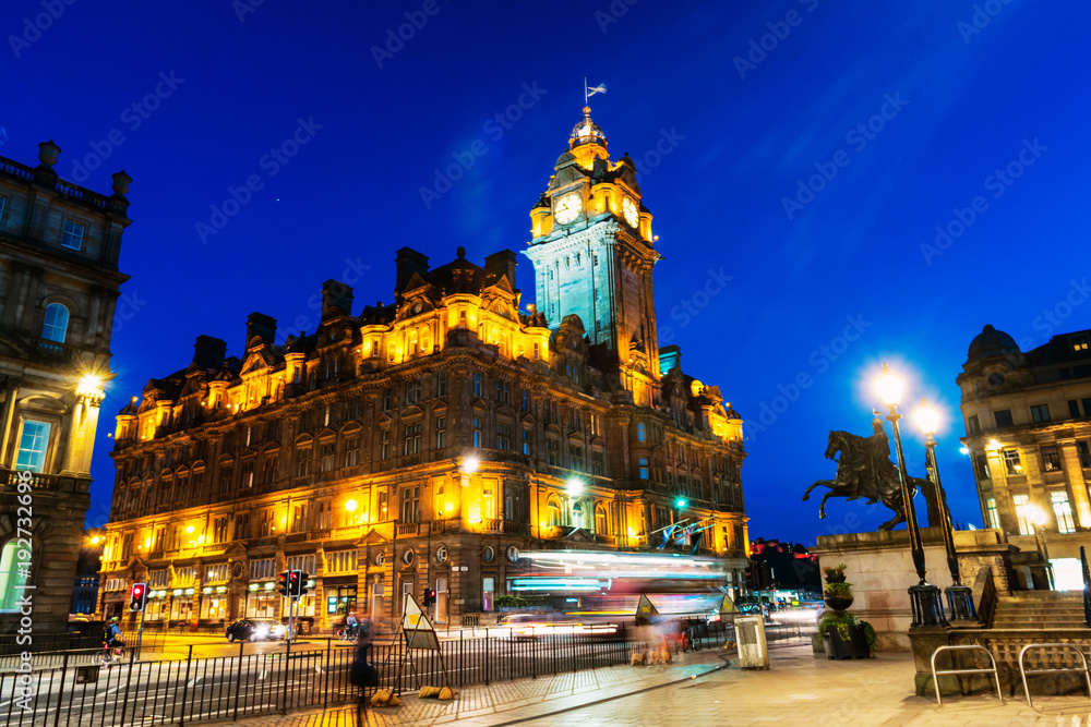 Night view of Edinburgh, Scotland with illuminated Balmoral Hotel
