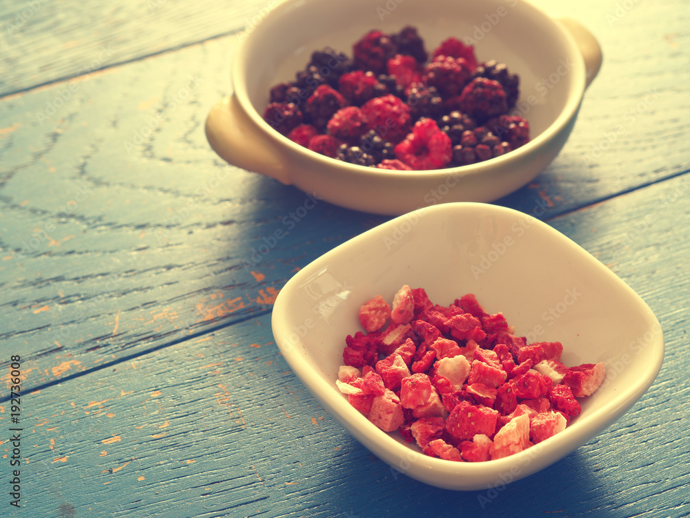 Dried organic berries in bowls Dried organic berries in bowls