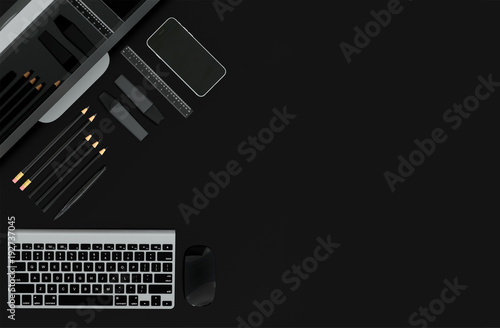 Modern office desk table with computer and stationery set isolated on black. Back to school concept with space for text. Top view. Flat lay. 3D illustration