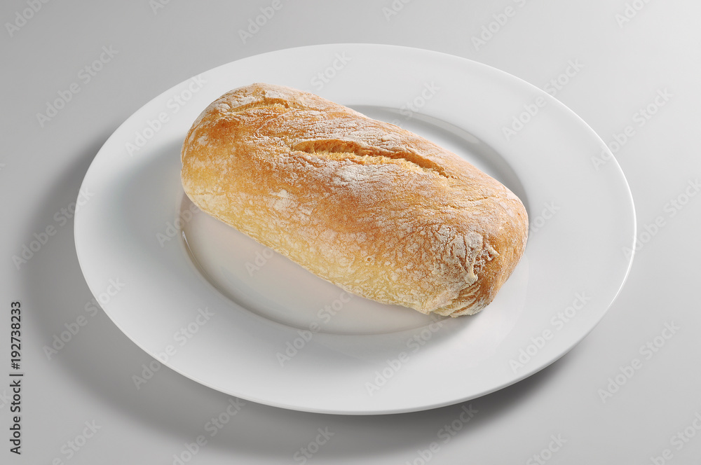Round dish with bread roll Ciabatta