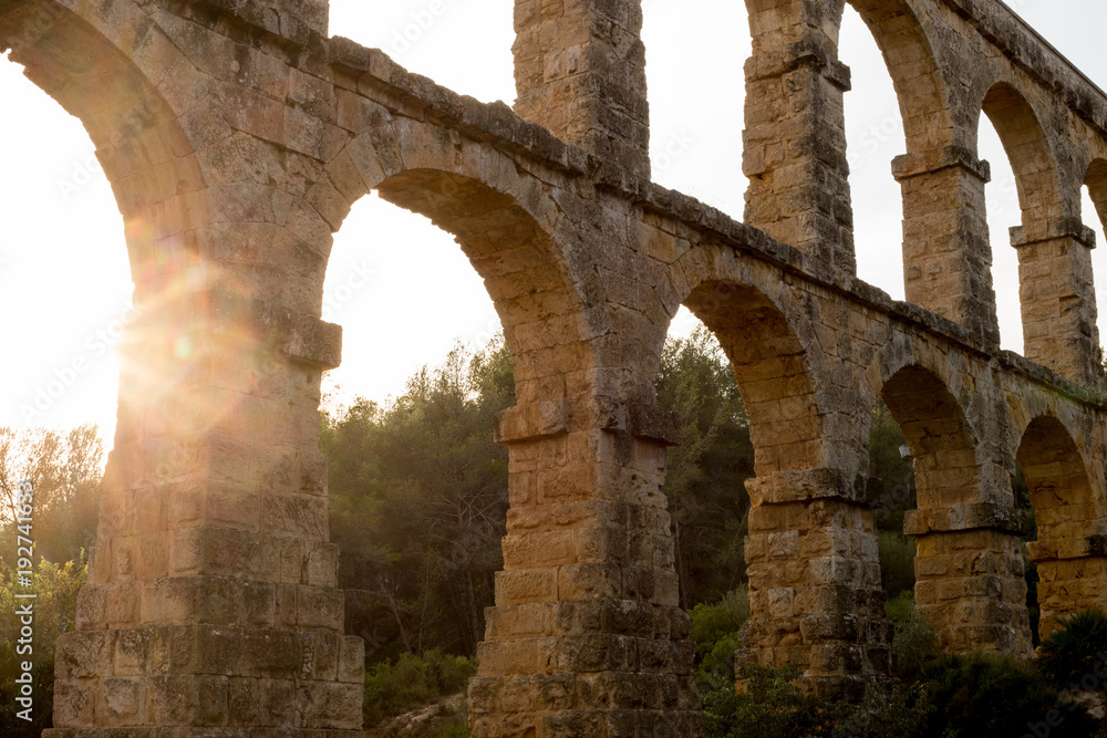 Beautiful view of roman Aqueduct Pont del Diable in Tarragona at sunset