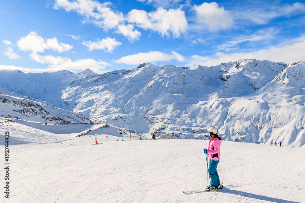 Young woman skier looking at beautiful mountain panorama in winter season, Obergurgl-Hochgurgl ski area, Austria