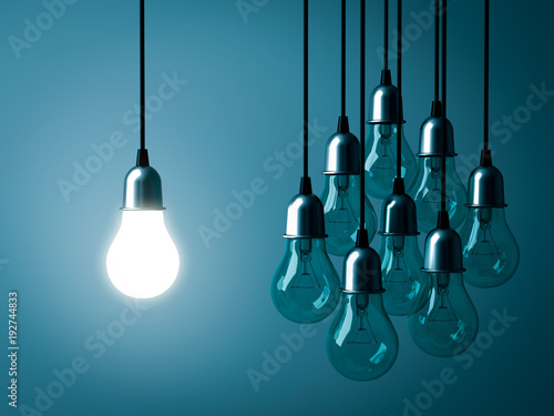 One hanging light bulb glowing and standing out from unlit incandescent bulbs on dark green pastel color background. 3D rendering.