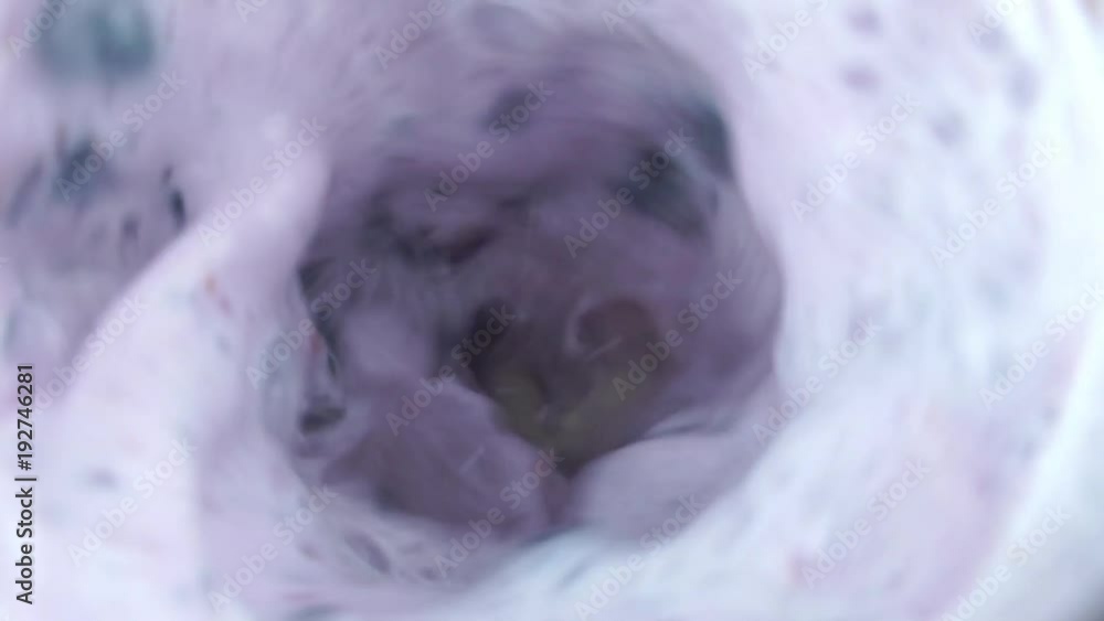 Close-up slow motion video of blueberry smoothie in blender Close-up slow motion video of blueberry smoothie in blender