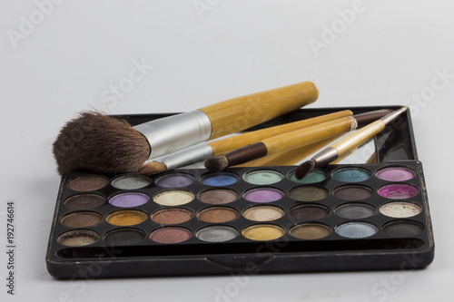 .women's beauty products (lipstick, headlight, powder)