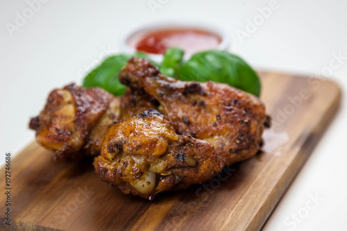Chicken wings with sweet chilli sauce on the white background
