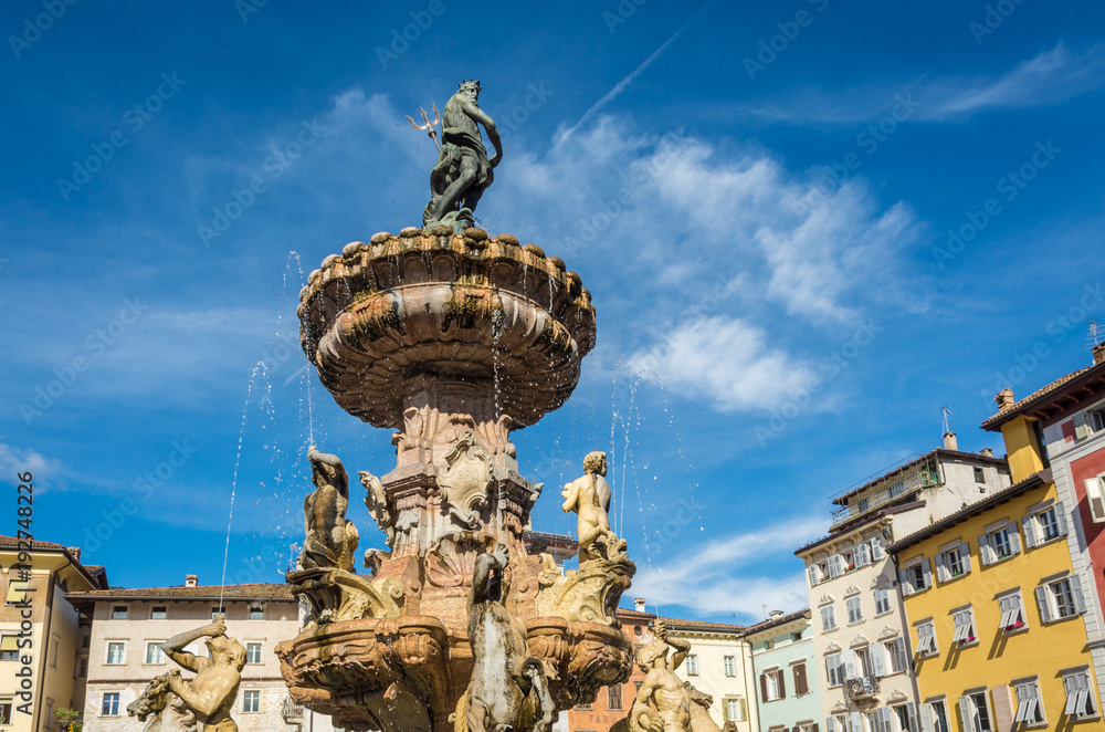 Fototapeta premium Trento city: main square Piazza Duomo, with clock tower and the Late Baroque Fountain of Neptune. City in Trentino Alto Adige, northern Italy, Europe