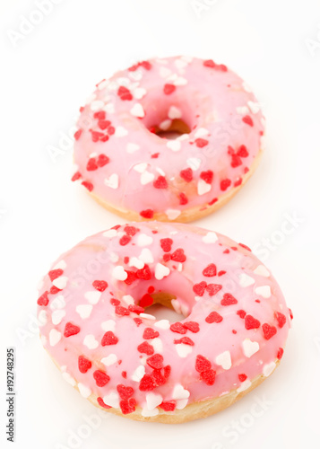 pink glazed donuts, with red hearts