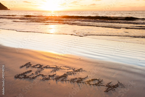 Photography happy birthday on sand beach