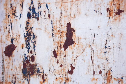 Background iron rusty artistic wall peeling paint.Grunge texture.Very graphic and edgy spray on metal abstract .
